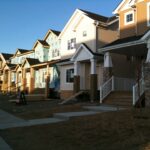 Row of newly built family houses with front porches