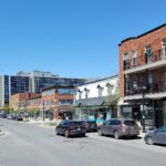 Shops and brick buildings on Victoria Avenue in downtown Saint-Lambert