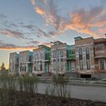 New townhouses under construction at sunset in a Canadian subdivision
